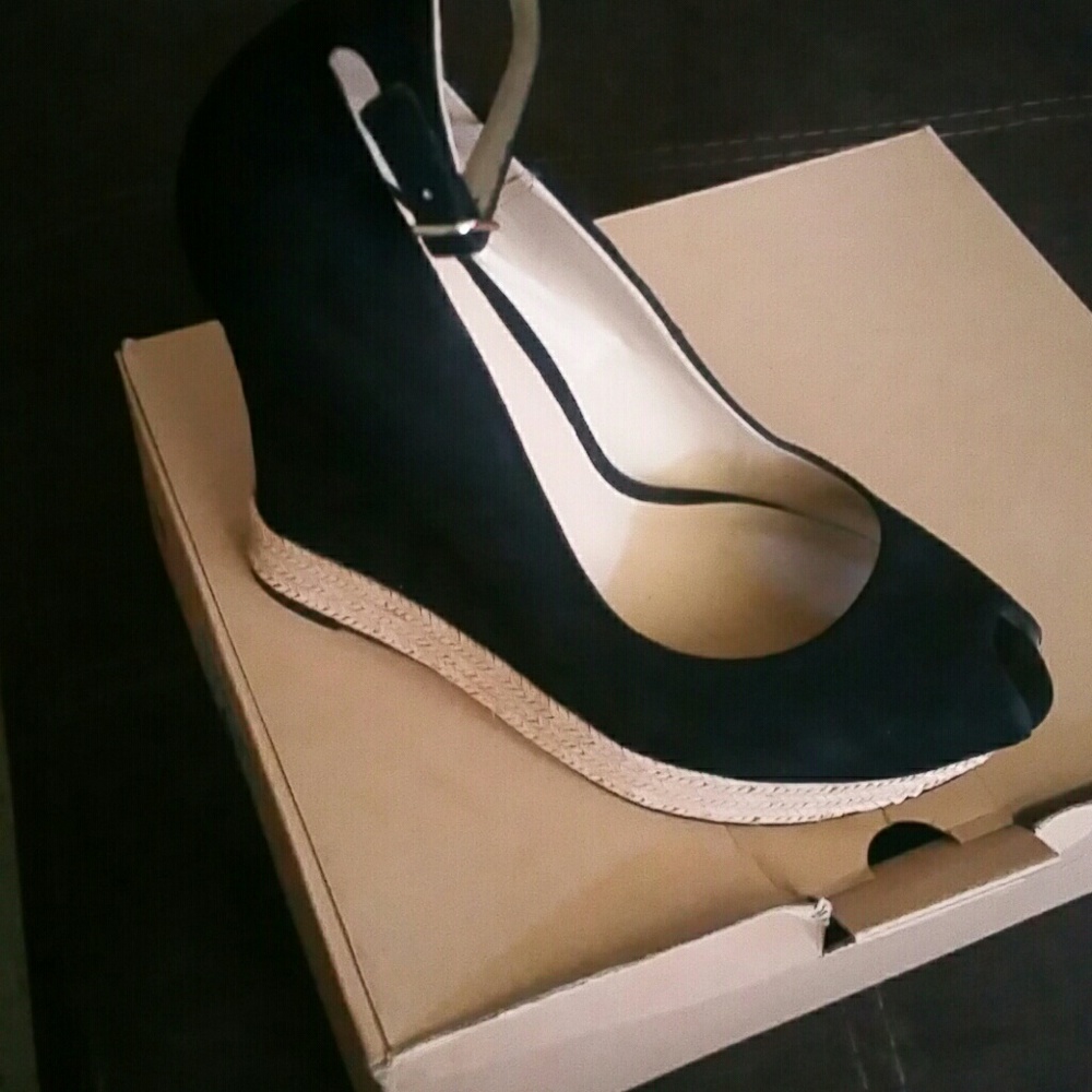 Peep toe black wedge suede shoe....